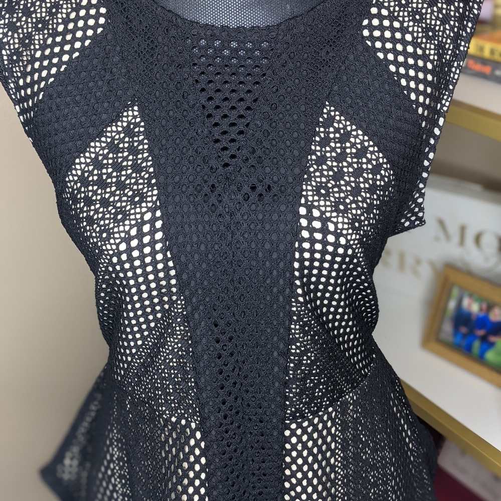 Make an offer on this beautiful black crochet lace peplum top.